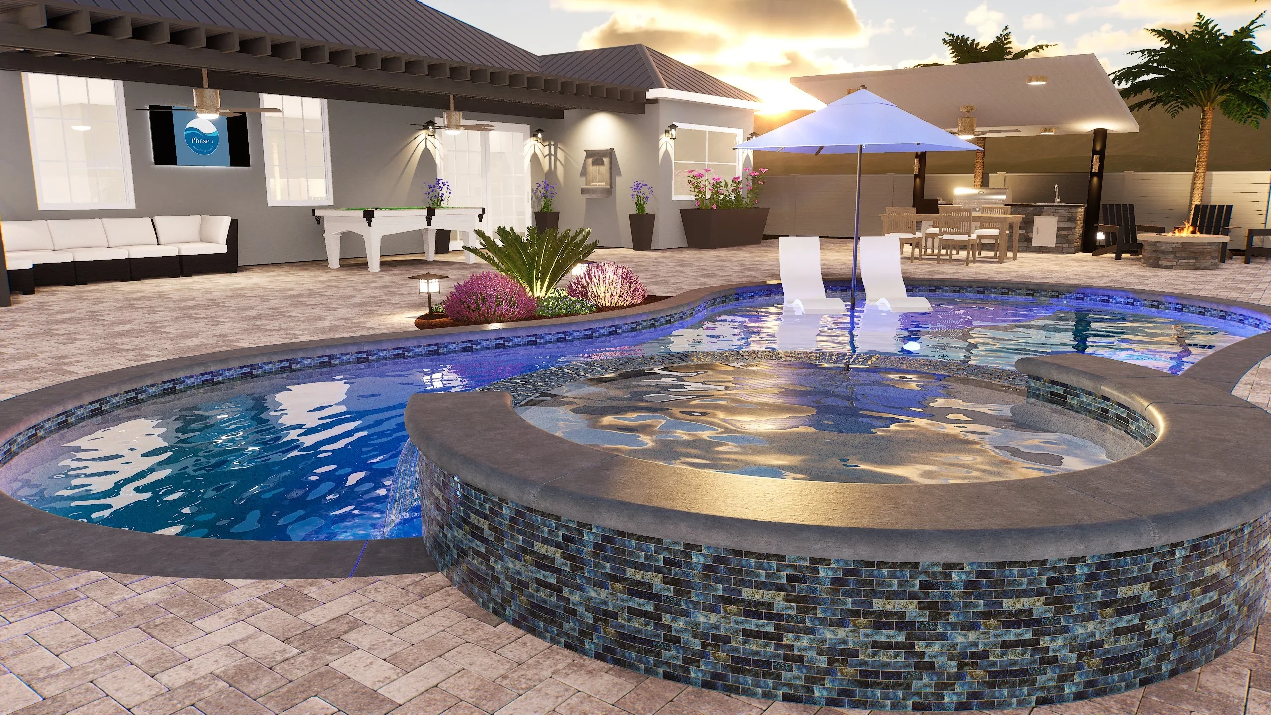 Freeform pool with glass tile spa, concrete decking, and resort-style patio area